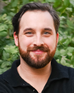 Portrait of Dylan Lynch, Head of Information Security and Information Technology